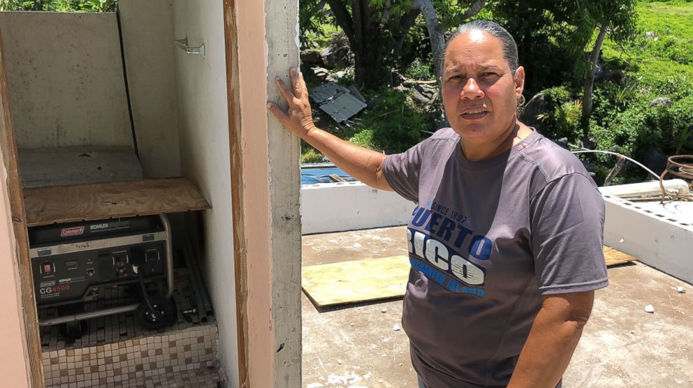 PHOTO: Norma Burgo, who also still does not have power and runs her generator 12 hours. The generator sits inside a bathroom on what was left of the second floor of her home, which was wiped off during the storm.