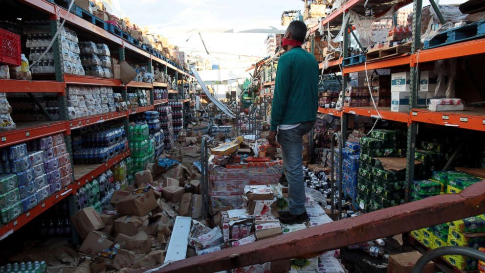A man stands inside of a destroyed supermarket by Hurricane Maria in Salinas, Puerto Rico, Sept. 29, 2017. 