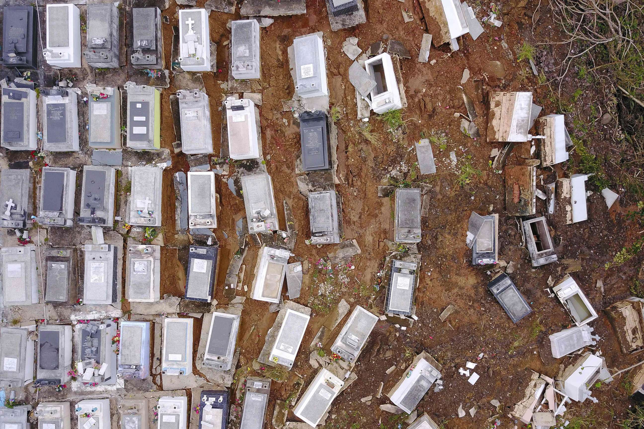 PHOTO: Coffins that were washed downhill from the Lares Municipal Cemetery by a landslide are seen in the aftermath of Hurricane Maria, Sept. 30, 2017, in Lares, Puerto Rico. 