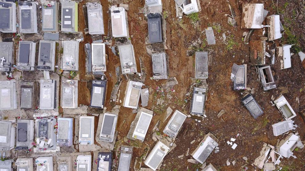 PHOTO: Coffins that were washed downhill from the Lares Municipal Cemetery by a landslide are seen in the aftermath of Hurricane Maria, Sept. 30, 2017, in Lares, Puerto Rico. 