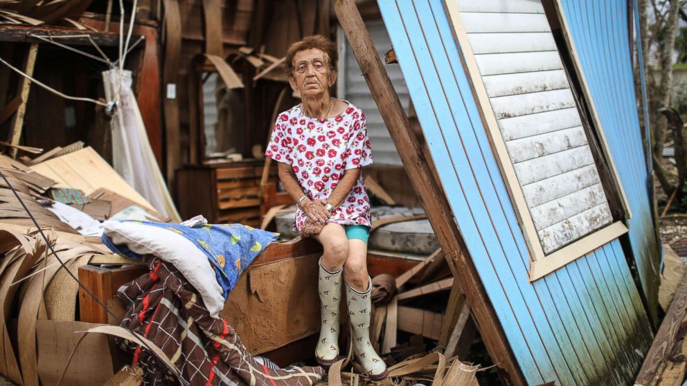 PHOTO: Sonia Torres poses in her destroyed home, while taking a break from cleaning, three weeks after Hurricane Maria hit the island, Oct. 11, 2017, in Aibonito, Puerto Rico.