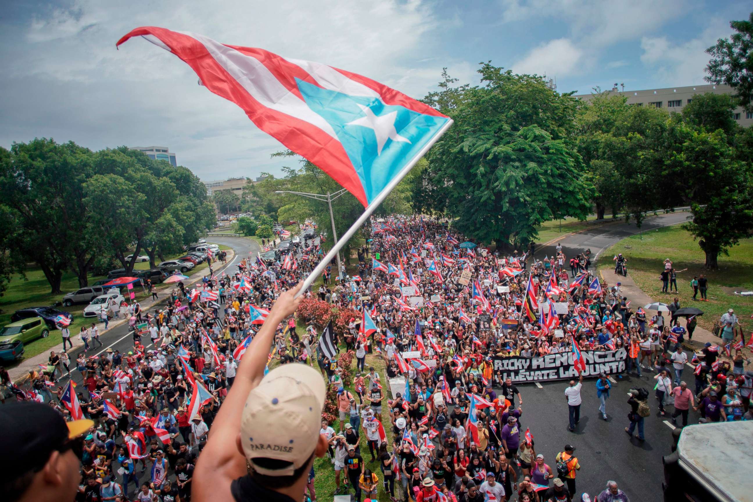PHOTO: People march in San Juan on July 25, 2019, one day after the resignation of Puerto Rico Governor Ricardo Rossello.