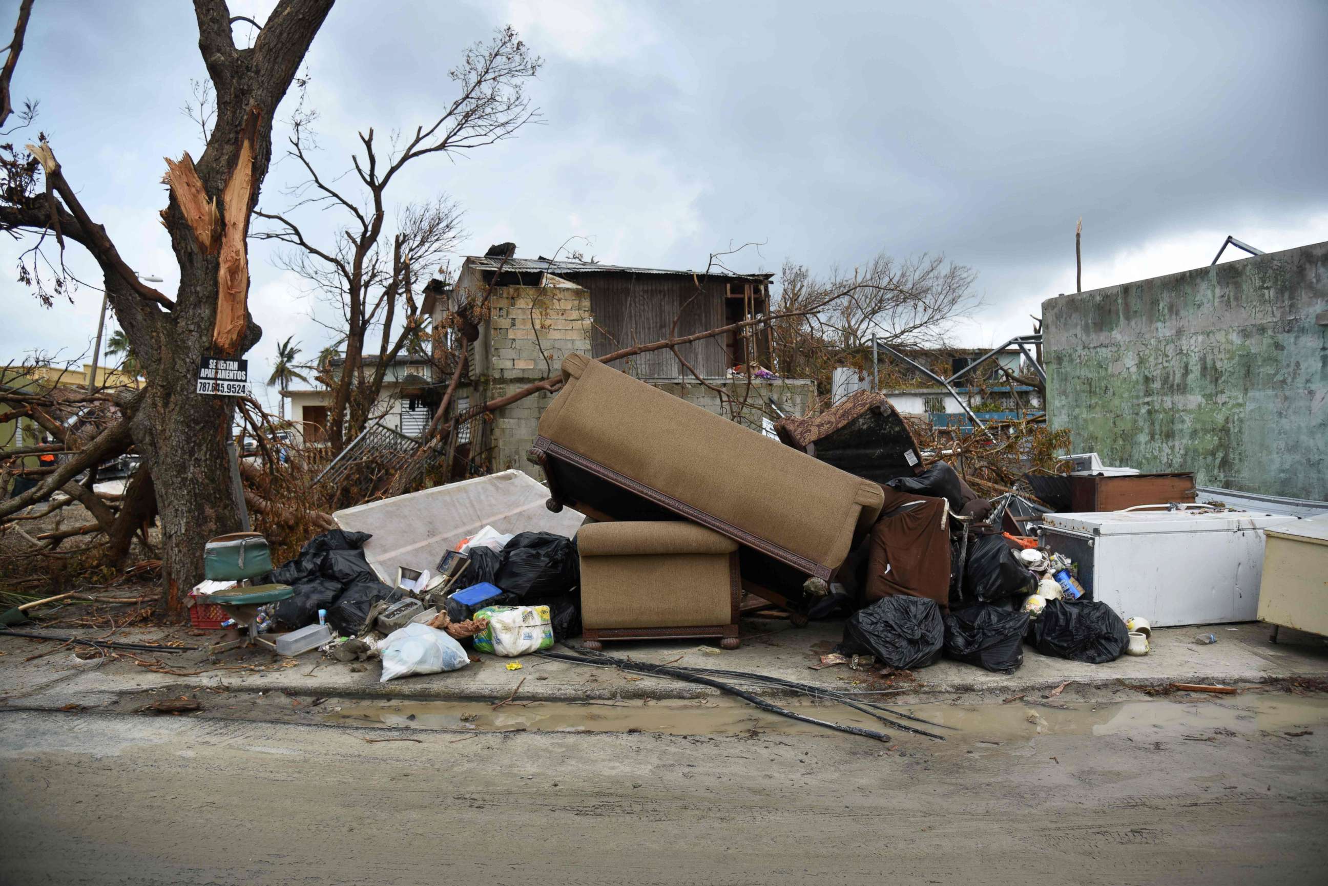 PHOTO: View of furniture near damaged houses in Punta Cabeza, Puerto Rico, Sept.27, 2017, one week after the passage of Hurricane Maria.