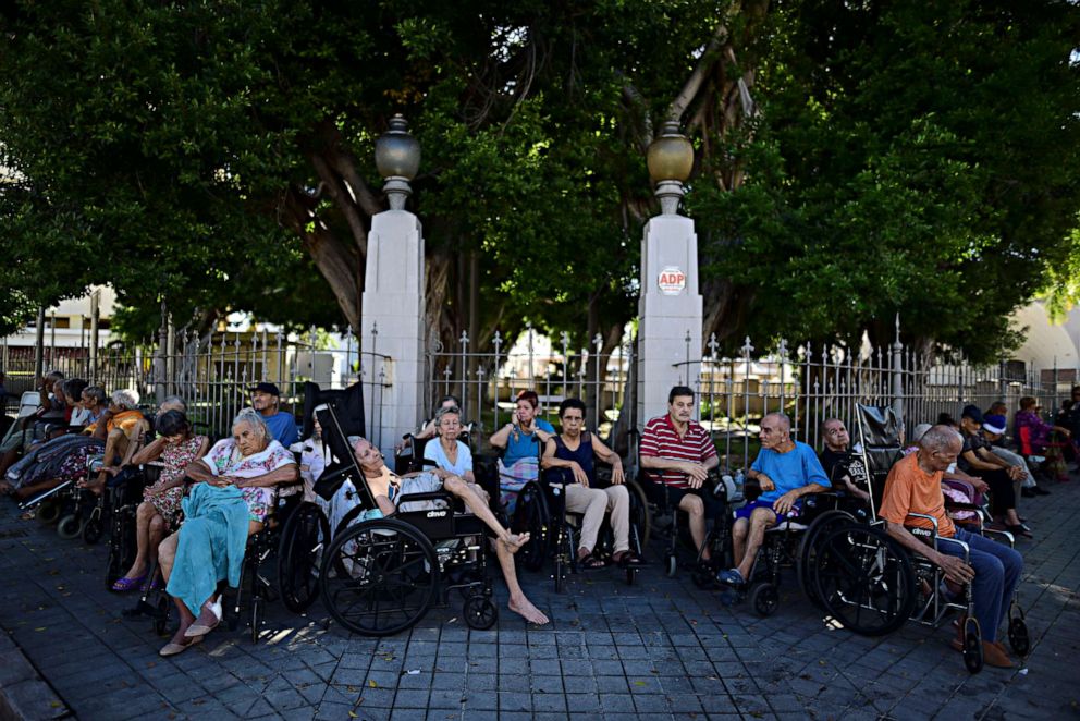 PHOTO: Residents of a nursing home sit outside of it after they were evacuated due to an earthquake in Ponce, Puerto Rico, Jan. 7, 2020.