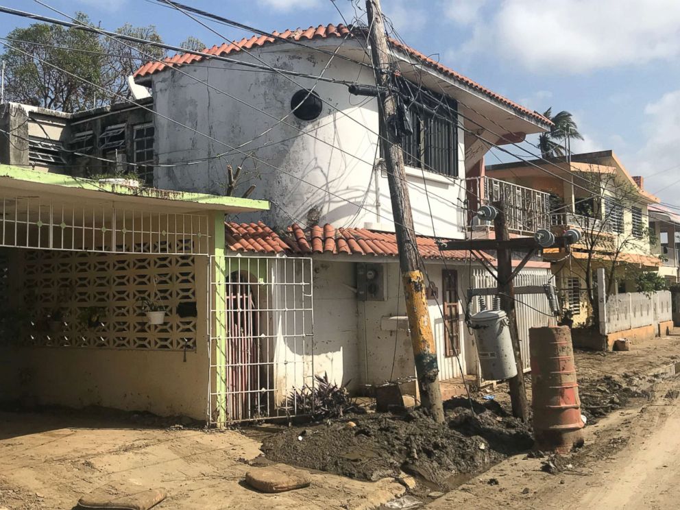 PHOTO: The town of Comerío in Puerto Rico where two weeks after Hurricane Maria struck, snapped utility poles still stand and streets remain covered in mud, Oct. 5, 2017. 