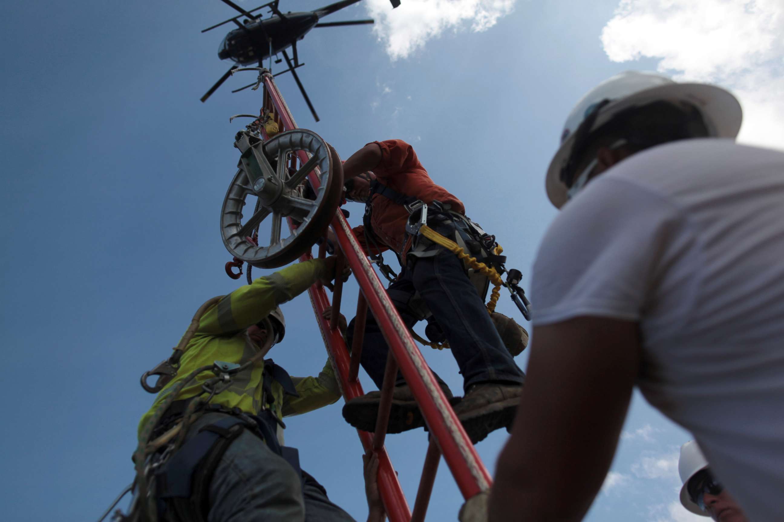 PHOTO: Workers from Montana-based Whitefish Energy Holdings help fix the island's power grid, damaged during Hurricane Maria in September, in Manati, Puerto Rico, Oct. 25, 2017.