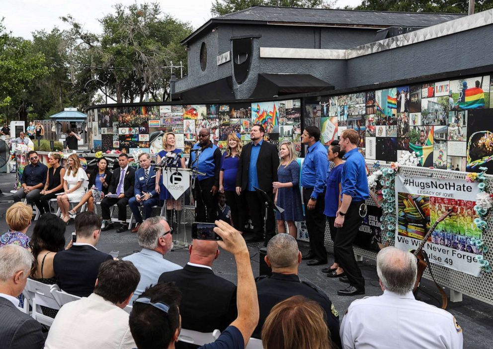 PHOTO: A group from Central Florida Community Arts sings during an announcement from U.S. Representatives Stephanie Murphy, Darren Soto, and Val Demings on June 10, 2019, at the Pulse Interim Memorial, in Orlando, Fla.