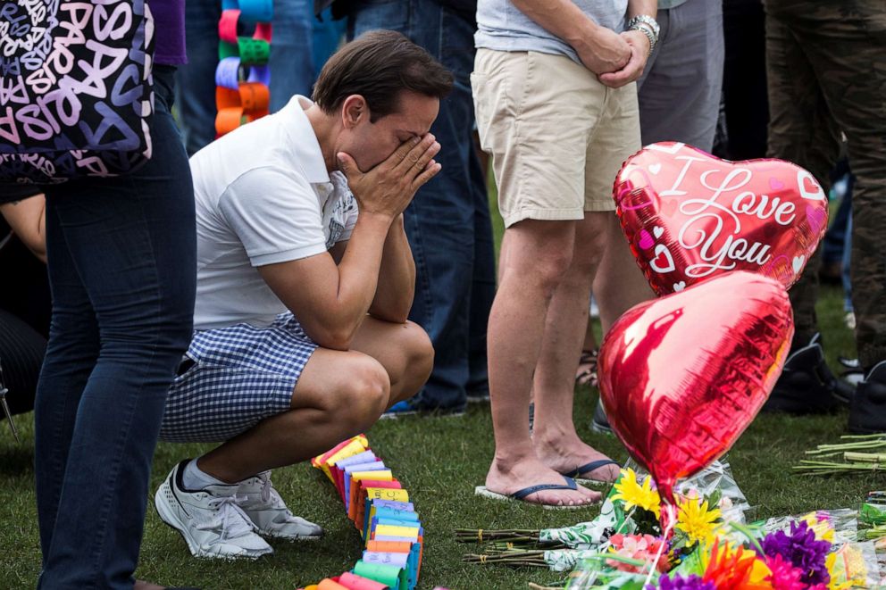 PHOTO: A man grieves at a make shift memorial for the victims of the Pulse nightclub massacre at the Dr. Phillips Center for the Performing Arts in Orlando, Fla., June 13, 2016.