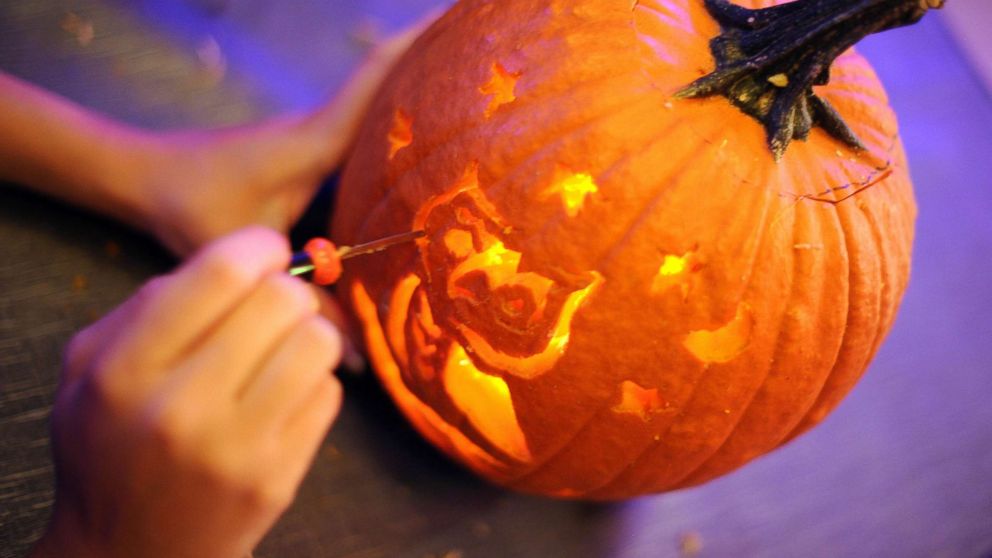 PHOTO: The finishing touches are given to this pumpkin carving of an owl which took third place, Oct. 27, 2010, at the Helix Hotel in Washington.