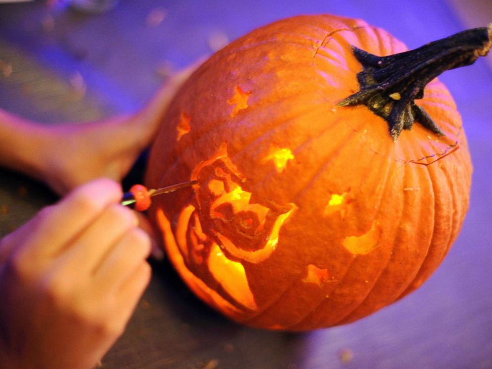 PHOTO: The finishing touches are given to this pumpkin carving of an owl which took third place, Oct. 27, 2010, at the Helix Hotel in Washington.