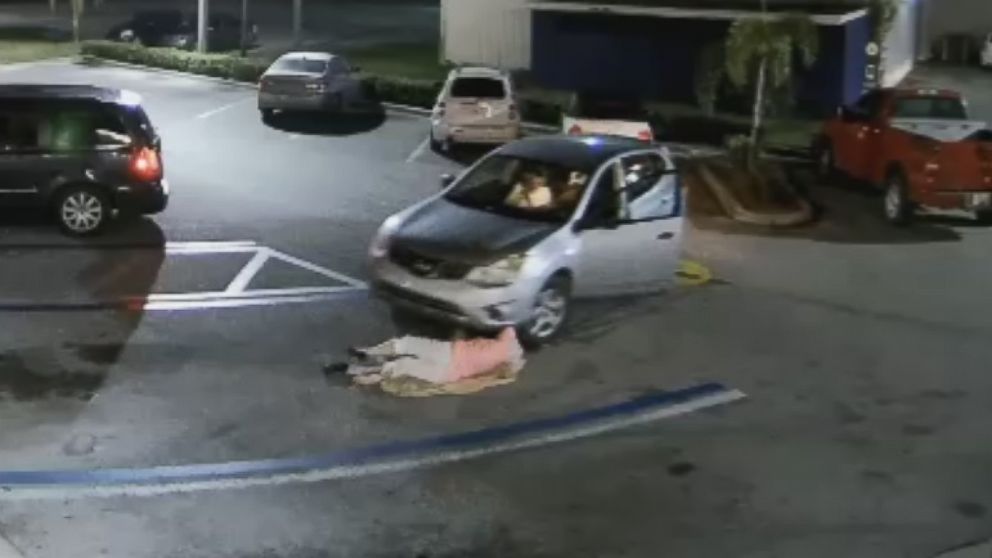 PHOTO: The driver dragged the woman before she fell to the ground, the tires narrowly missing her head. 