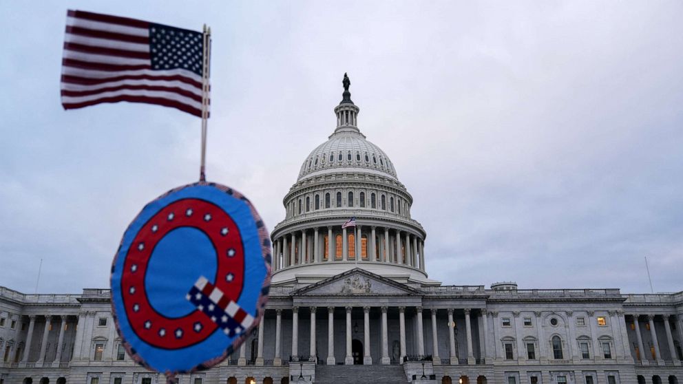 PHOTO: A demonstrator holds a "Q" sign outside the U.S. Capitol in Washington, D.C., Jan. 6, 2021.