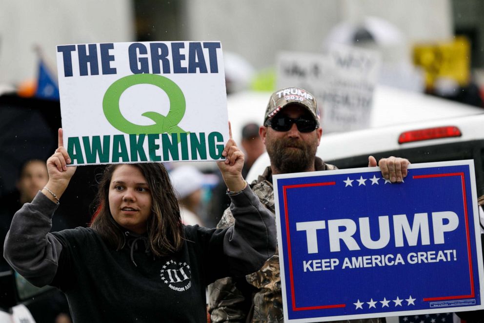 PHOTO: The Q-Anon conspiracy theorists  hold signs during the protest at the State Capitol in Salem, Oregon, May 2, 2020.