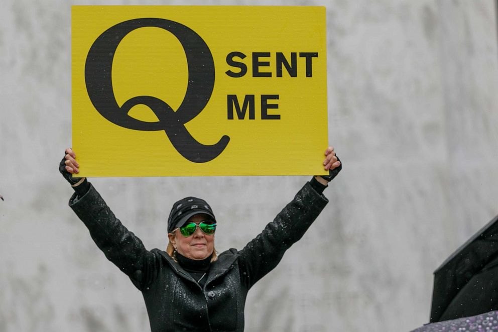 PHOTO: The Q-Anon conspiracy theorists  hold signs during the protest at the State Capitol in Salem, Oregon, May 2, 2020.