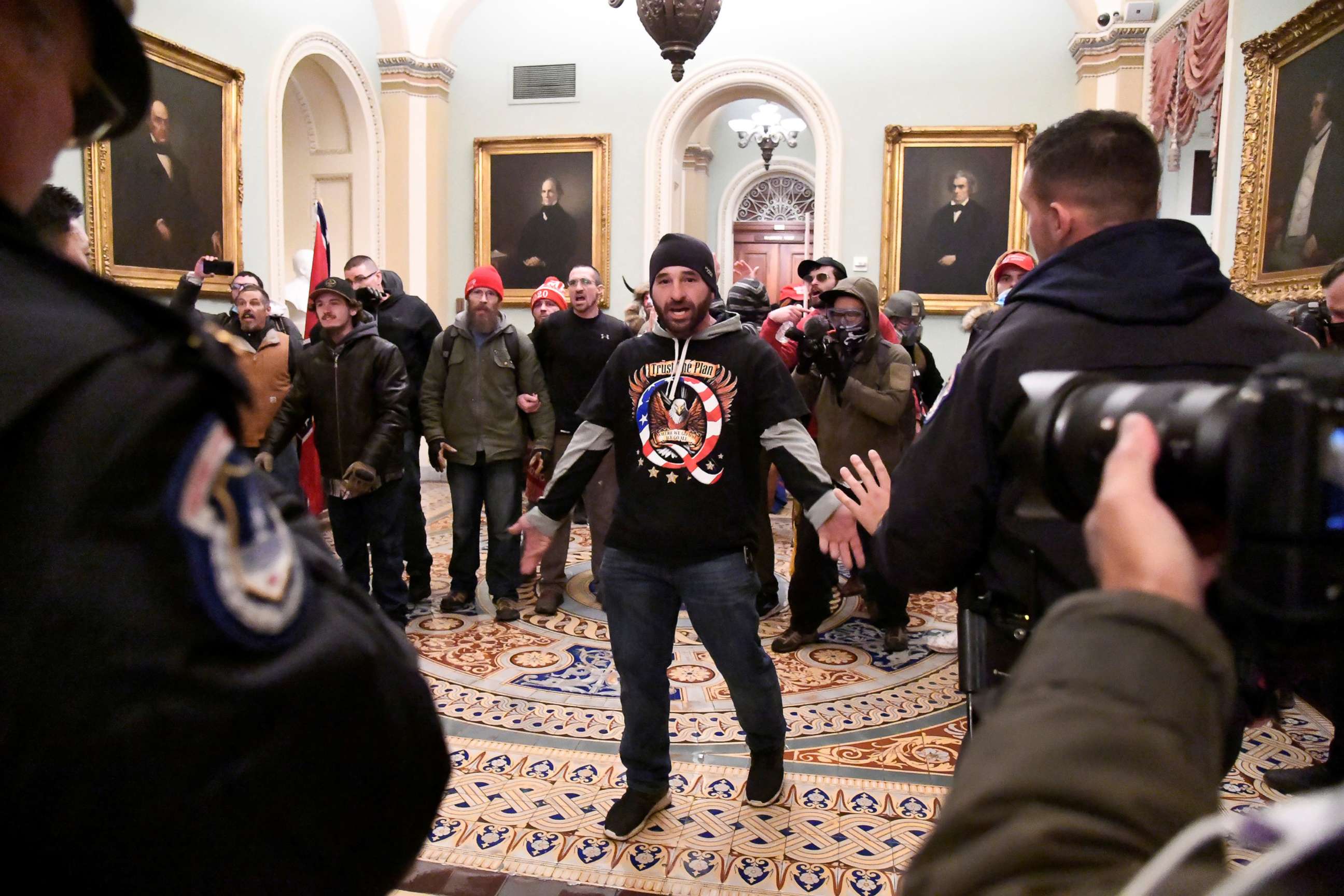 PHOTO: A man later identified as Douglas Jensen confronts police as Trump supporters demonstrate on the second floor of the Capitol near the entrance to the Senate, Jan. 6, 2021.   