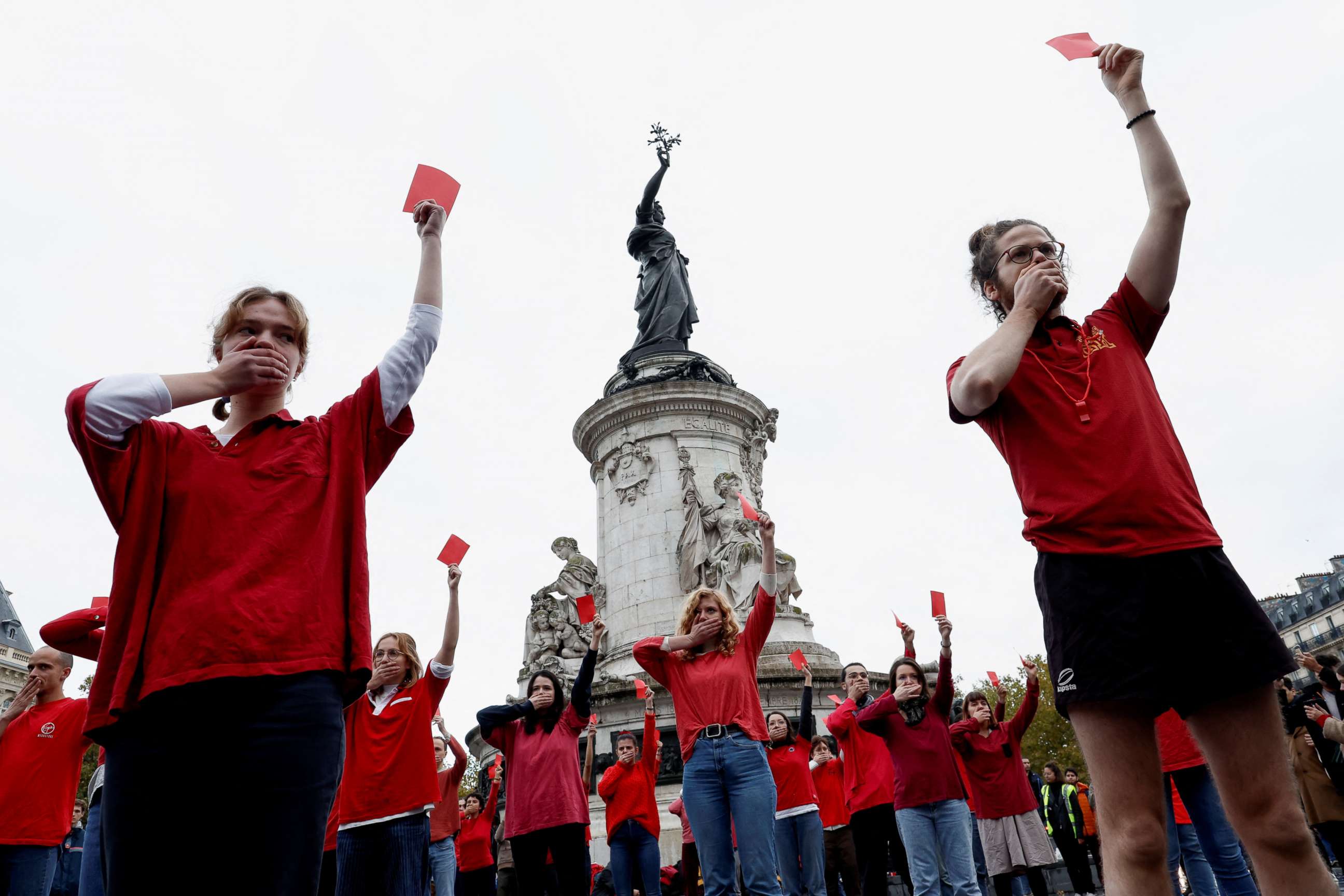 PHOTO: Activists from "Carton rouge pour le Qatar" (Red card for the Qatar) stage a demonstration to protest against the FIFA World Cup Qatar, at the Place de la Republique in Paris, Nov. 20, 2022.