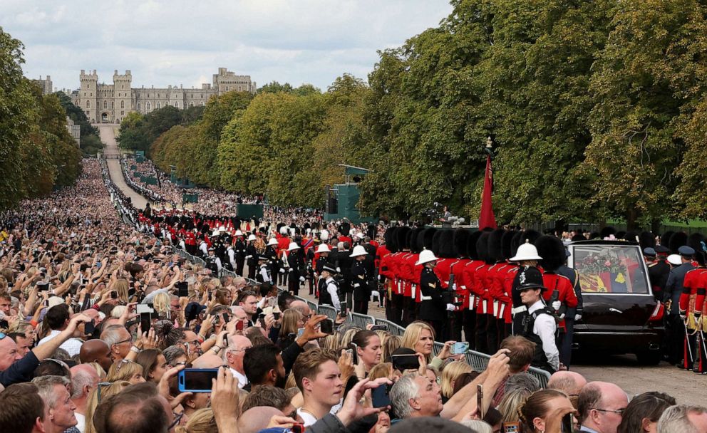 PHOTO:FILE - The hearse carrying Britain's Queen Elizabeth's coffin is escorted down the long route to Windsor Castle in the funeral procession in Windsor, Britain, September 19, 2022.