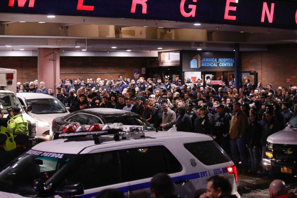 PHOTO: Officers salute a procession as the remains of slain Detective Brian Simonsen are removed from Jamaica Hospital, Feb. 12, 2019, in the Queens borough of N.Y.