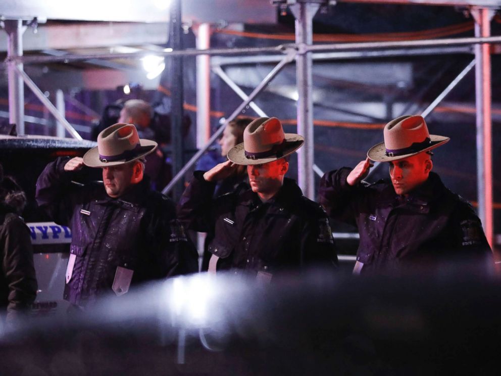 PHOTO: Officers salute a procession as the remains of slain Detective Brian Simonsen are removed from Jamaica Hospital, Feb. 12, 2019, in the Queens borough of N.Y.