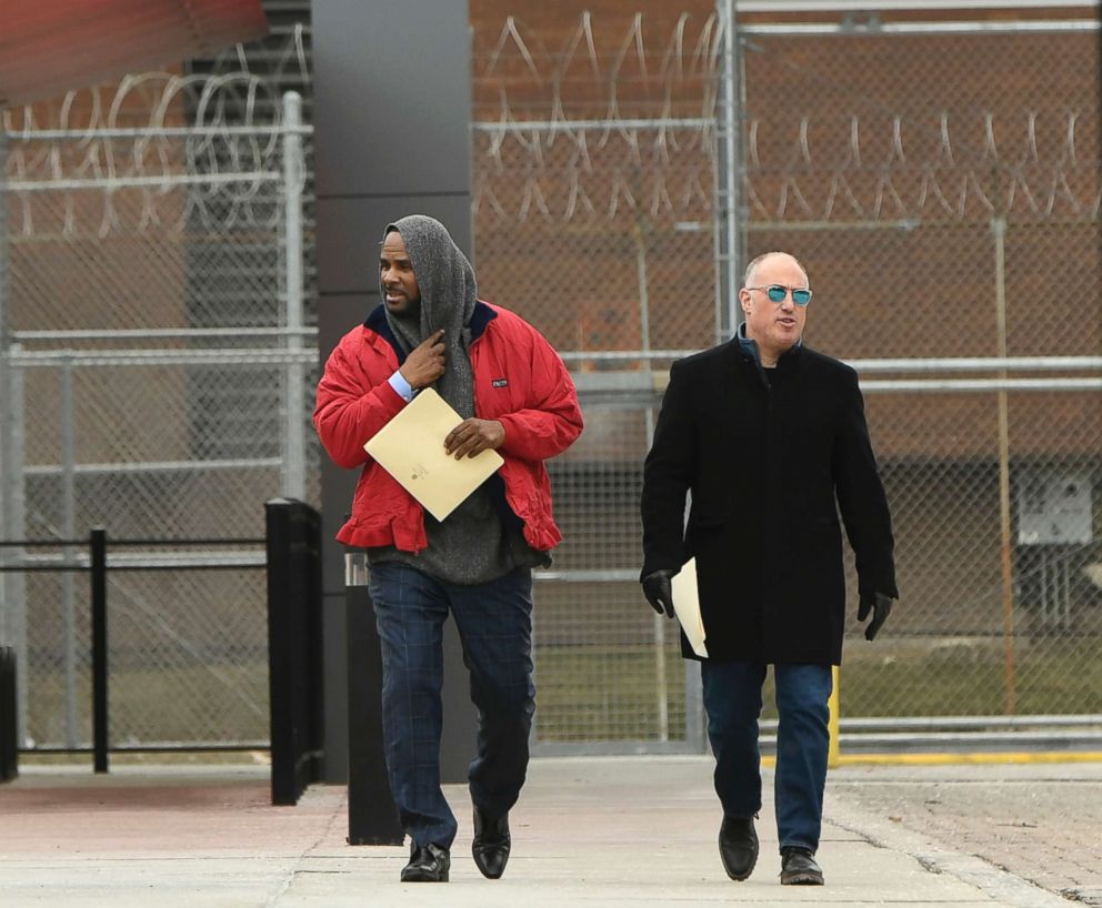 PHOTO: Singer R. Kelly, left, walks with his attorney Steve Greenberg after being released from Cook County Jail in Chicago,  March 9, 2019.