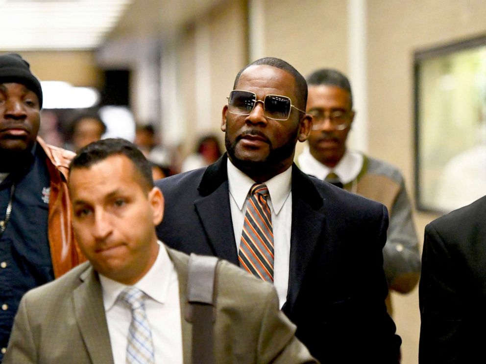 PHOTO: Musician R. Kelly, in the center, leaves the Daley Center after a hearing in his child support case on May 8, 2019 in Chicago.