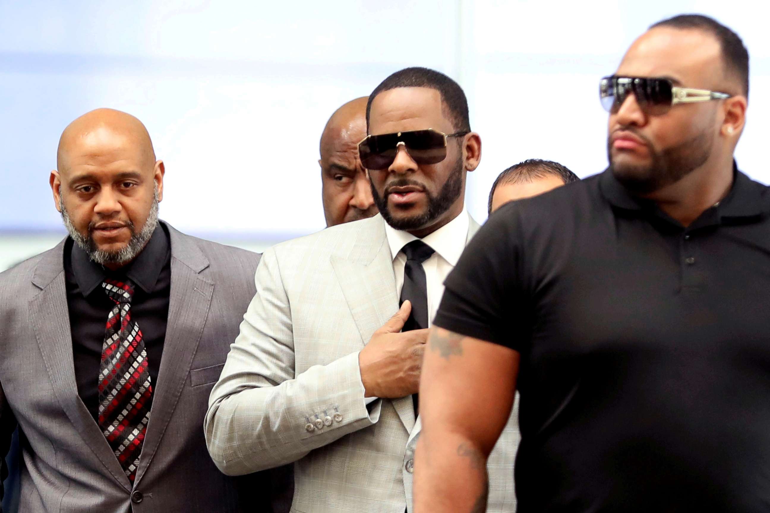 PHOTO: File Photo: R. Kelly, center, walks inside the Criminal Court Building as he arrives for a hearing on charges of criminal sexual abuse in Chicago on June 6, 2019.