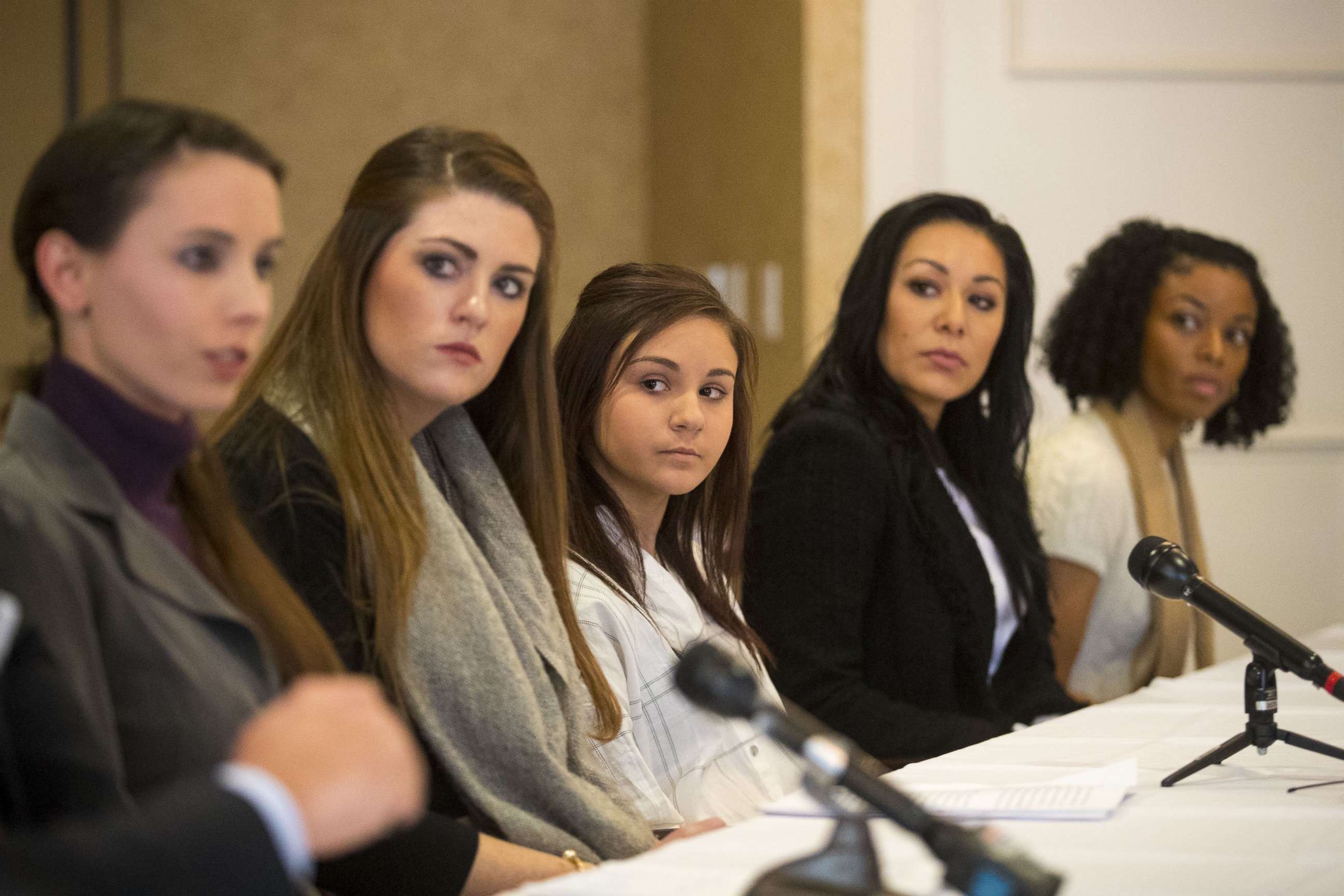 PHOTO: (L-) Rachael Denhollander, Sterling Riethman, Kaylee Lorincz, Jeanette Antolin and Tiffany Thomas appear at a press conference after Larry Nassar was sentenced to 60 years in prison on child pornography charges in Grand Rapids, Mich., Dec. 7, 2017.