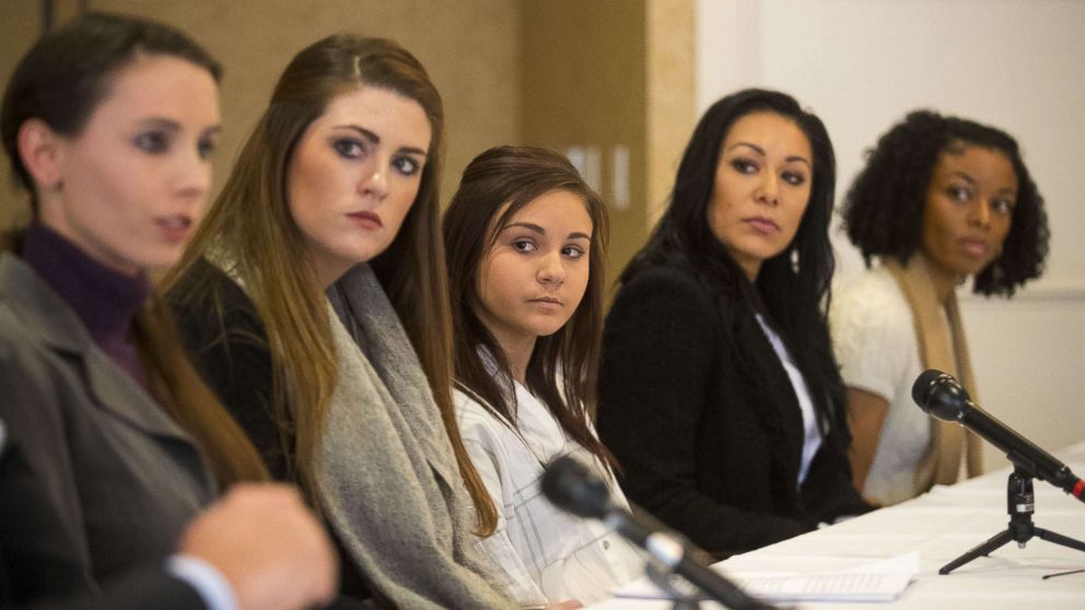 PHOTO: (L-) Rachael Denhollander, Sterling Riethman, Kaylee Lorincz, Jeanette Antolin and Tiffany Thomas appear at a press conference after Larry Nassar was sentenced to 60 years in prison on child pornography charges in Grand Rapids, Mich., Dec. 7, 2017.