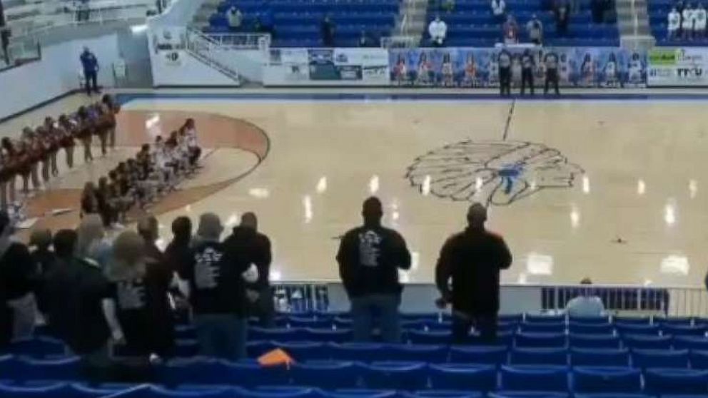 PHOTO: Players from Norman High School girls' basketball team in Oklahoma take a knee in an image made from video aired on the NFHS Network's livestream broadcast of a game on March 11, 2021, that included audio of a person calling players a racial slur.