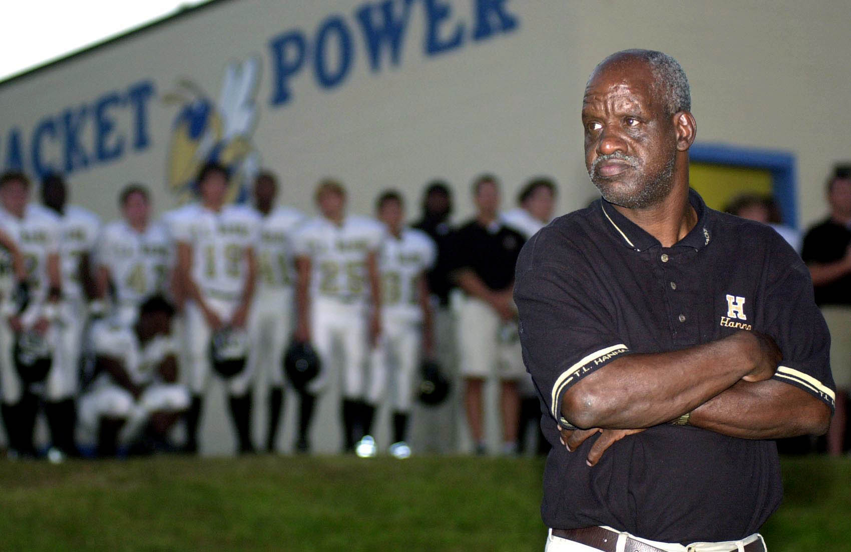 PHOTO: James "Radio" Kennedy stands with the T.L. Hanna High School varsity football team behind him in Anderson, S.C., Sept. 19, 2003. 