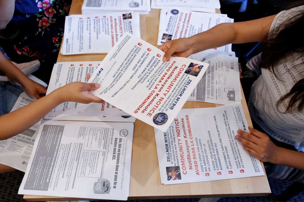 PHOTO: Community members hand out pamphlets as communities braced for a reported wave of deportation raids across the United States by Immigration and Customs Enforcement officers, in Brooklyn, July 14, 2019. 