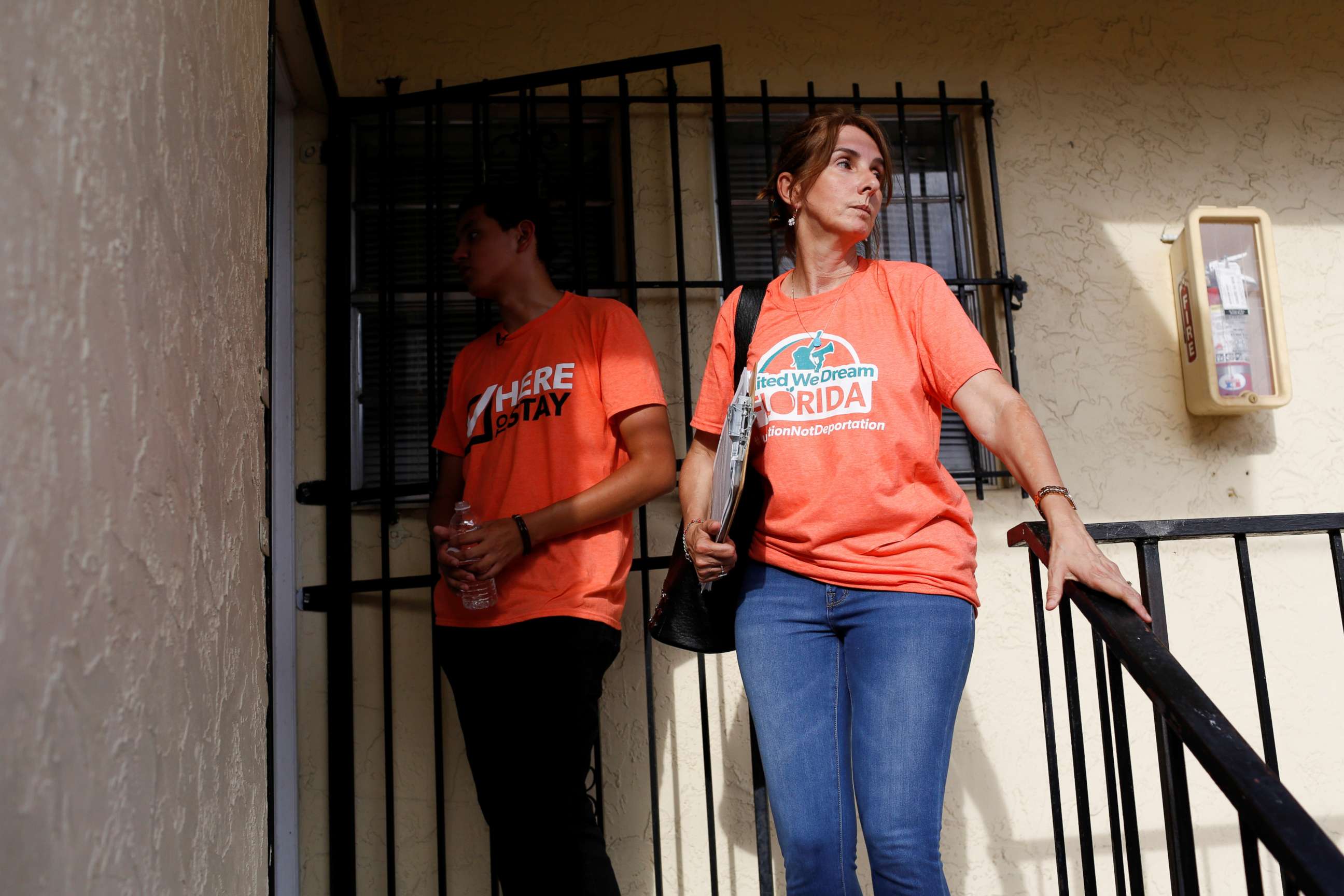 PHOTO: Immigration rights activists wait in front of the door of a house as communities braced for a reported wave of deportation raids across the United States by Immigration and Customs Enforcement officers, in Miami, July 13, 2019. 