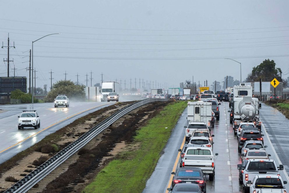 PHOTO: Cars are stopped in the northbound lanes of Highway 101 after flooding closed the highway near Chualar, Calif., Dec. 27, 2022.