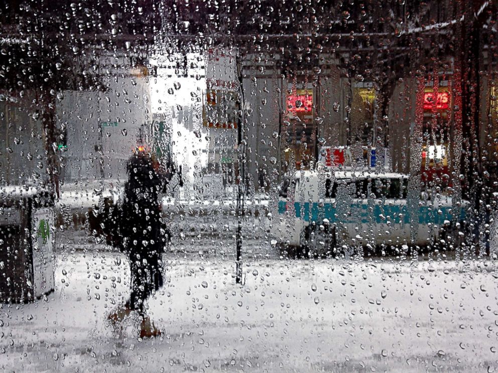 PHOTO: A woman walking on the sidewalk during a rainstorm in this undated photo.