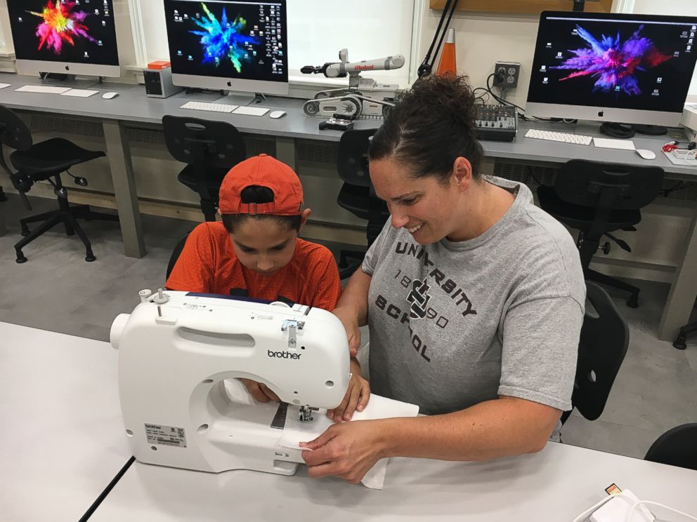 PHOTO: Cortney Dargaj and her son Gio Dargaj, 10, use a new sewing machine that they received to help with Gio's project of making pillows for the homeless. 