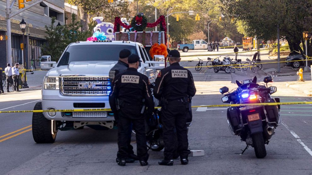 PHOTO: Police officers work at the scene after a truck pulling a float crashed at a holiday parade in Raleigh, NC, on Saturday, Nov. 19, 2022. 