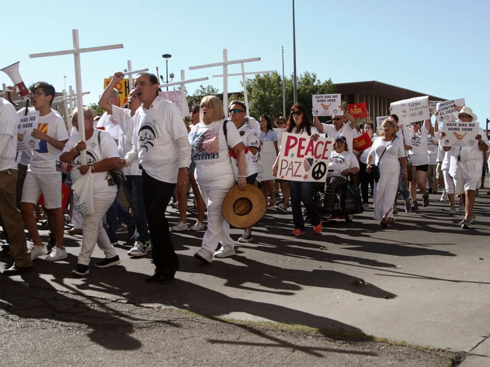 PHOTO: Participants in the League of United Latin American Citizens' "March For a United America," carry signs in El Paso, Texas, on Saturday, Aug. 10, 2019.