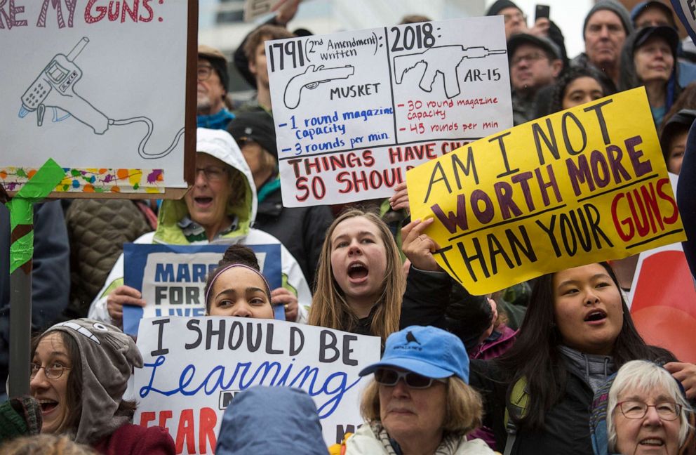 PHOTO: Protesters and students hold up signs as they take part in the March for Our Lives rally, March 24, 2018, in Portland, Ore.