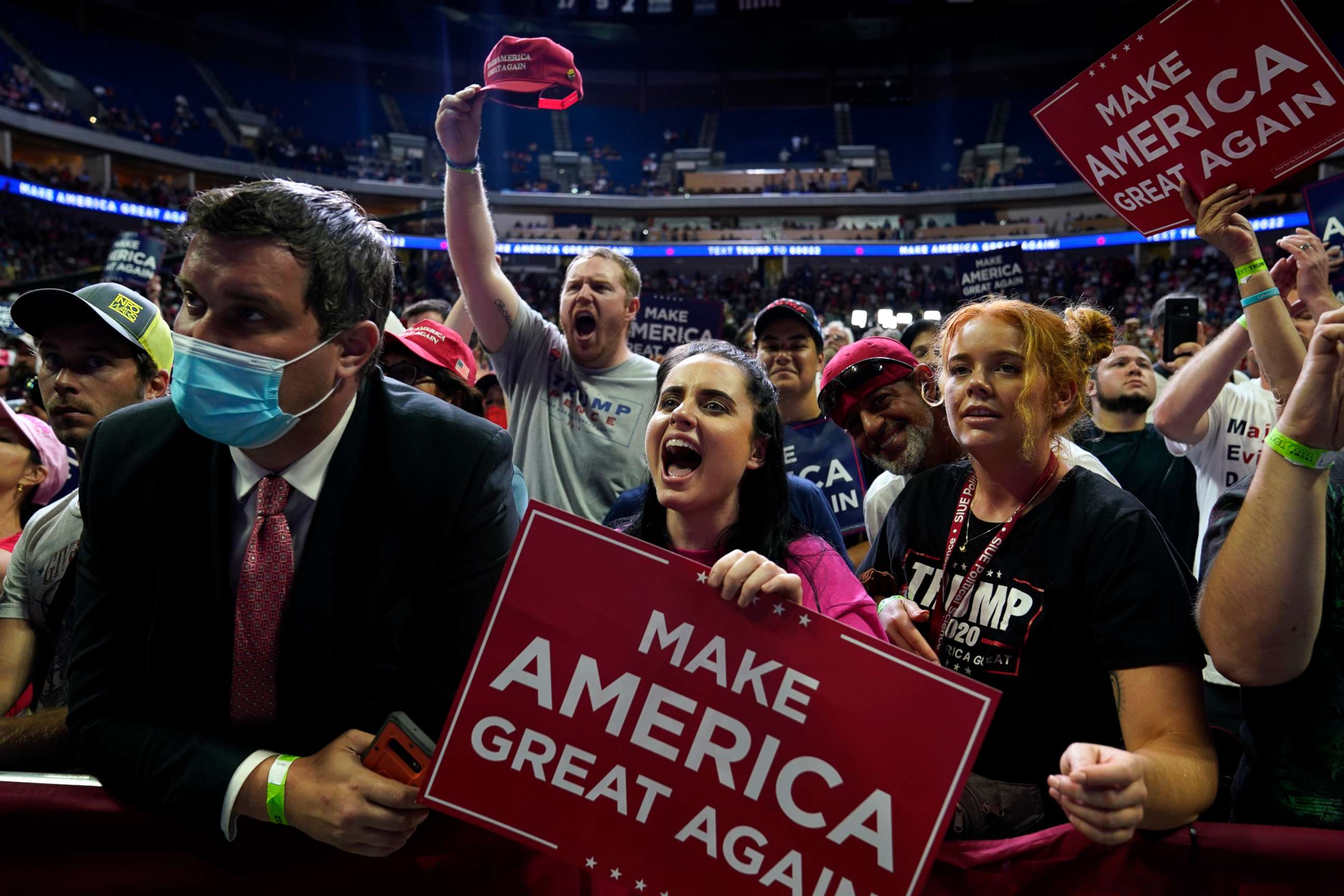 PHOTO: President Donald Trump supporters cheer as they attend a campaign rally at the BOK Center, Saturday, June 20, 2020, in Tulsa, Okla.