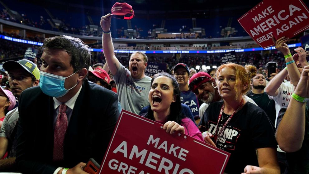 PHOTO: President Donald Trump supporters cheer as they attend a campaign rally at the BOK Center, Saturday, June 20, 2020, in Tulsa, Okla.