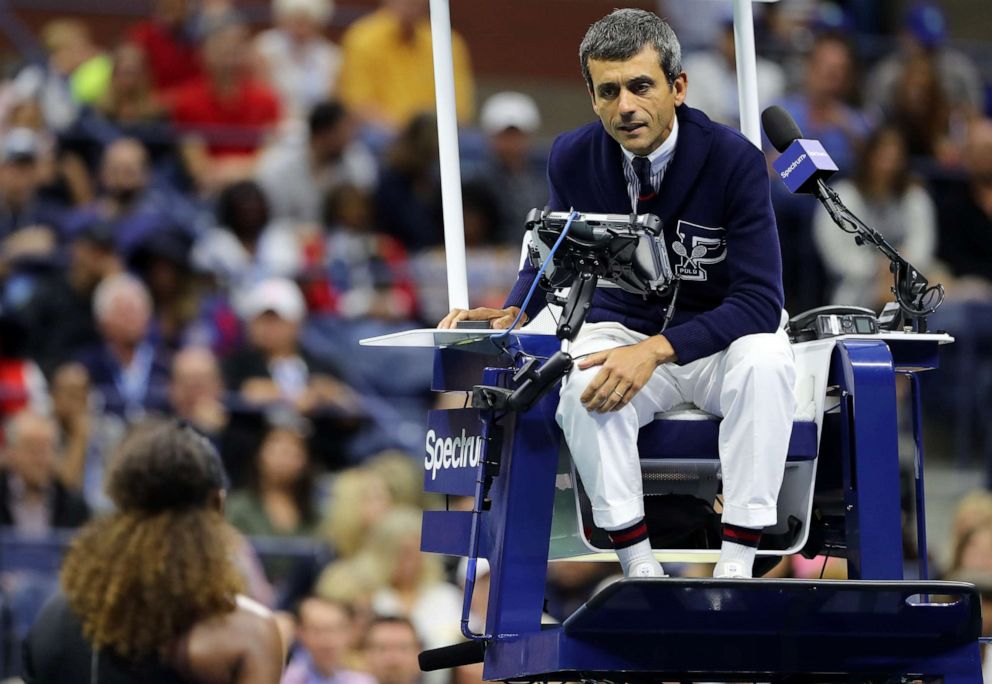 PHOTO: Serena Williams of the United States discusses a coaching violation warning given by umpire Carlos Ramos during her Women's Singles finals match against Naomi Osaka of Japan on Day Thirteen of the 2018 US Open.