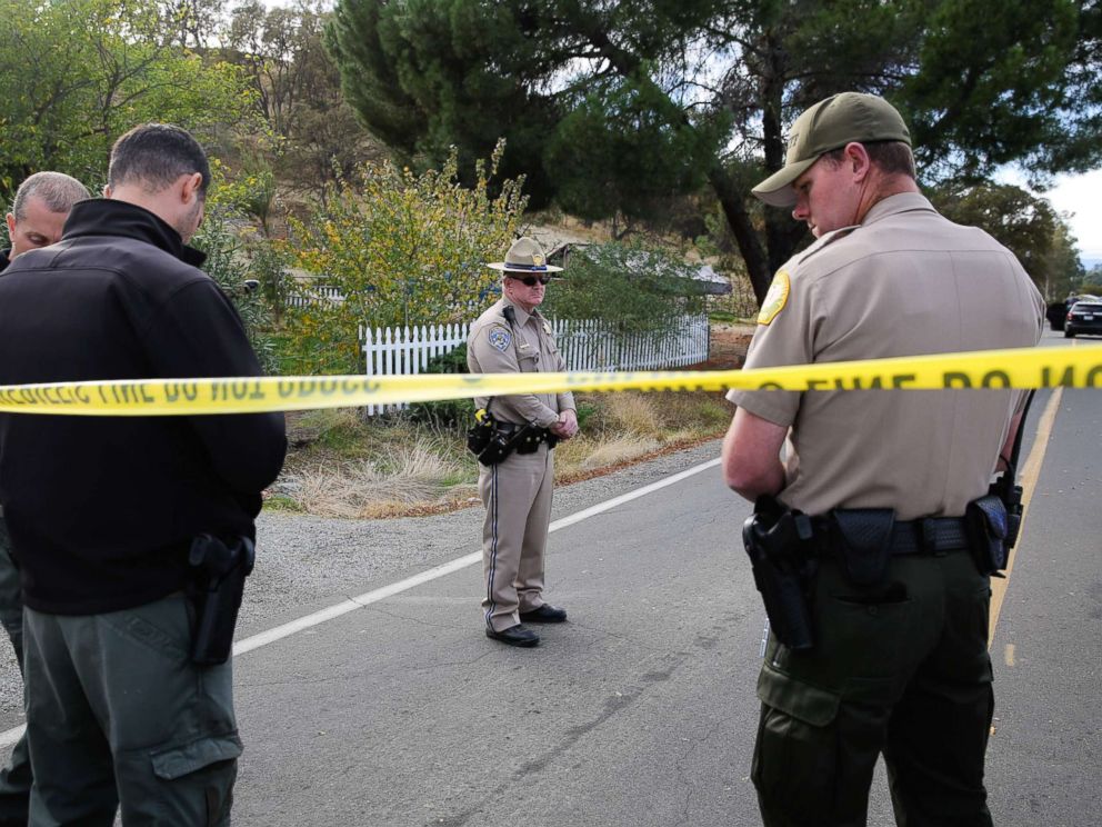 PHOTO: Law enforcement officers stand near one of many crime scenes after a shooting on Nov. 14, 2017, in Rancho Tehama, Calif.