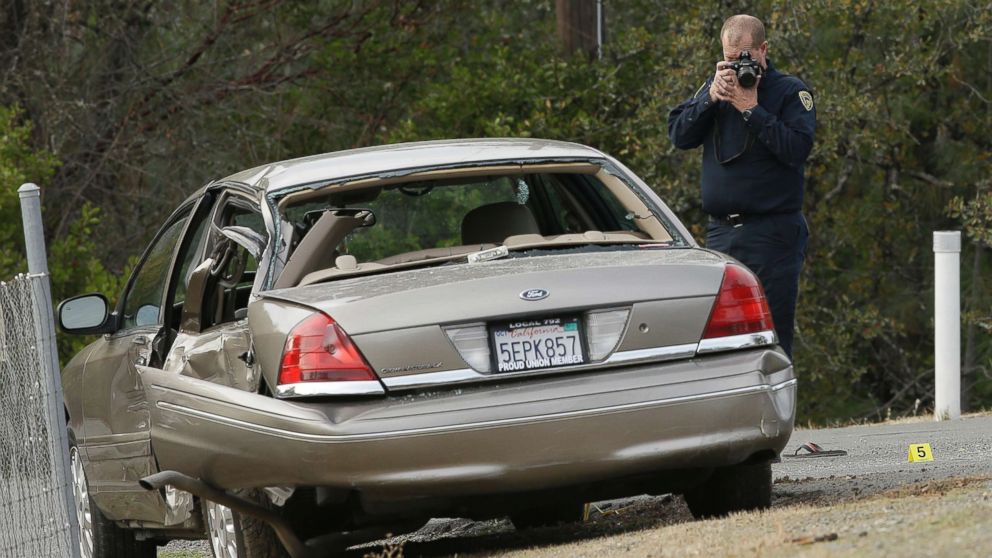 PHOTO: A California Highway patrol officer photographs a vehicle involved in a deadly shooting rampage at the Rancho Tehama Reserve, near Corning, Calif., Nov. 14, 2017.