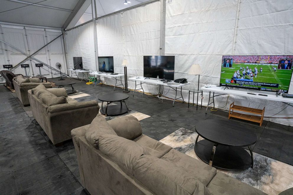 PHOTO: A TV watching lounge for temporarily housed migrants at the Humanitarian Emergency Response and Relief Center, which is designed to process and temporarily house migrants on Randall's Island in New York City, Oct. 18, 2022.