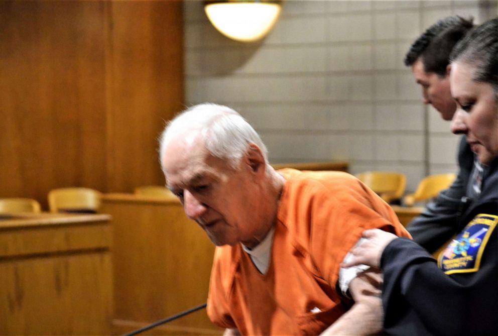 PHOTO: Raymond Vannieuwenhoven of Lakewood is assisted by a court security officer following a hearing, May 20, 2019, in Marinette County Circuit Court.