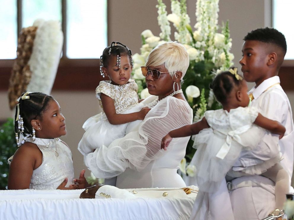 PHOTO: Tomika Miller, the widow of Rayshard Brooks, who was shot by an Atlanta police officer, holds their 2-year-old daughter Memory during the family processional of his funeral at Ebenezer Baptist Church in Atlanta, June 23, 2020.