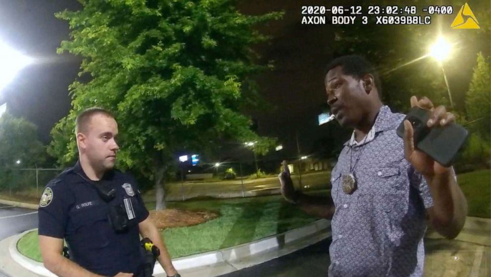 PHOTO: In this screen grab taken from body camera video provided by the Atlanta Police Department Rayshard Brooks, right, speaks with Officer Garrett Rolfe, left, in the parking lot of a Wendy's restaurant, in Atlanta, June 12, 2020.