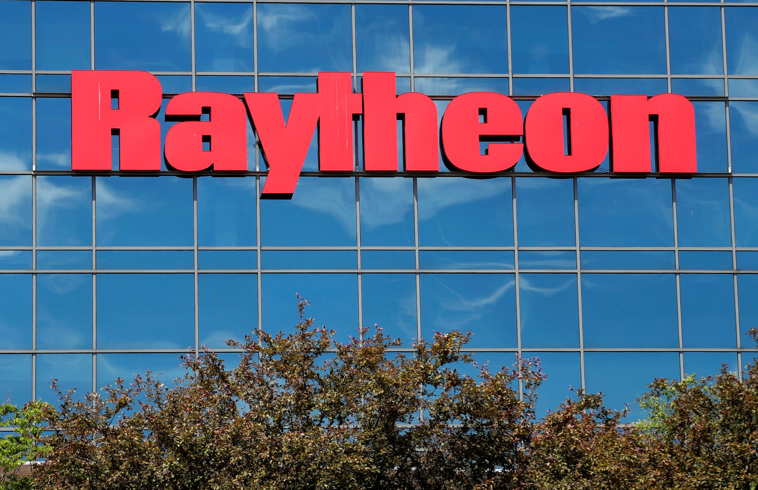 PHOTO: The sky is reflected on the facade of Raytheon's Integrated Defense Systems facility, Monday, June 10, 2019, in Woburn, Mass.