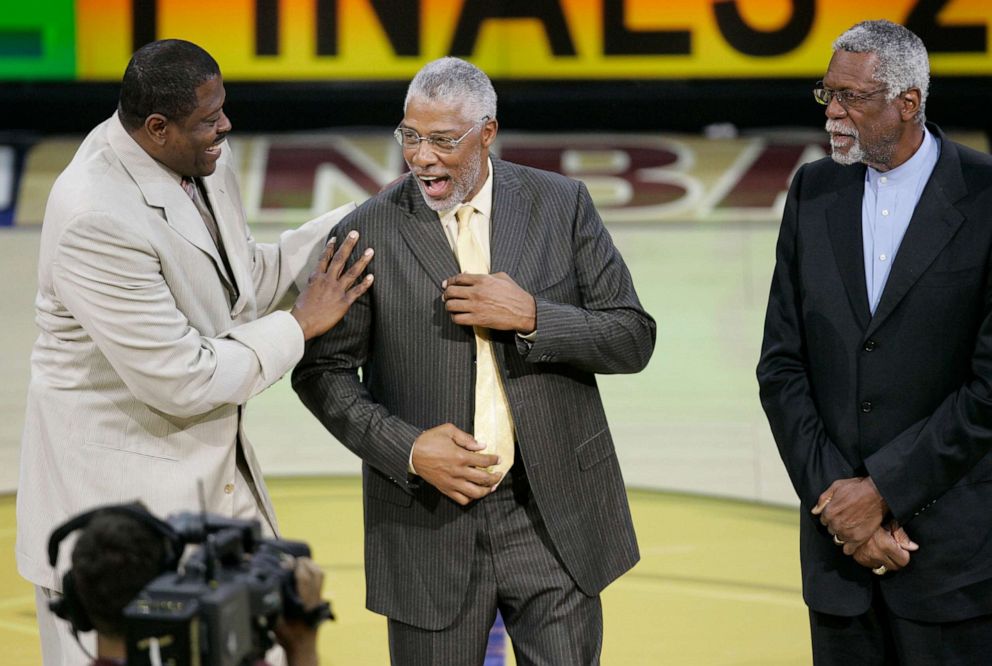 PHOTO: NBA great Patrick Ewing with NBA Hall of Famers Julius Irving and Bill Russell in Game 3 of the NBA Finals in Clevaland, June 12, 2007. 