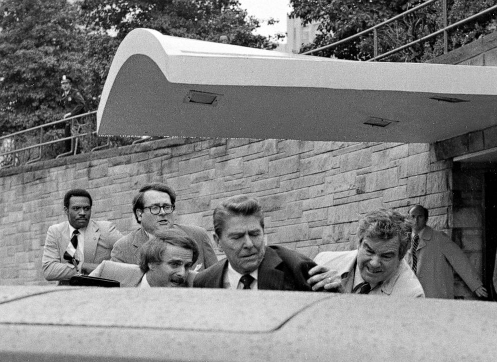 PHOTO: President Ronald Reagan is pushed into the President's limo by Secret Service agents after he was shot outside a Washington hotel, March 30, 1981.